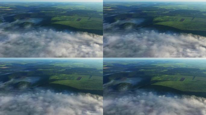 云层上方小山上的田野鸟瞰图，日出时河上的雾，河上的浓雾，德涅斯特河上的雾，晨雾中的河，日出时的雾