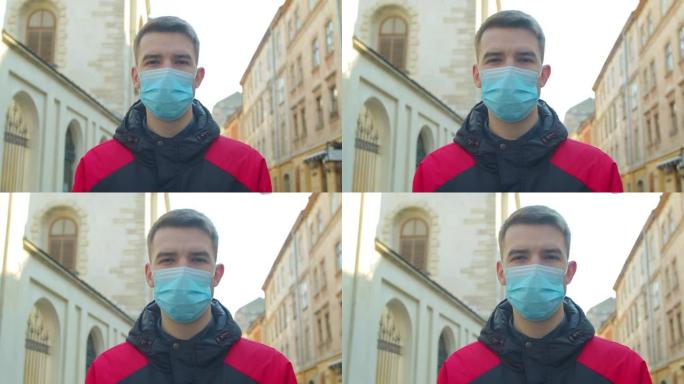 年轻的学生男子在街上戴着防护口罩。健康与安全生命的概念，N1H1冠状病毒，病毒保护。大流行新型冠状病