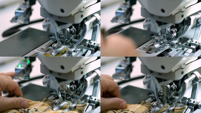 缝纫机的工作宏细节。针移动并缝制织物。纺织厂的材料切割