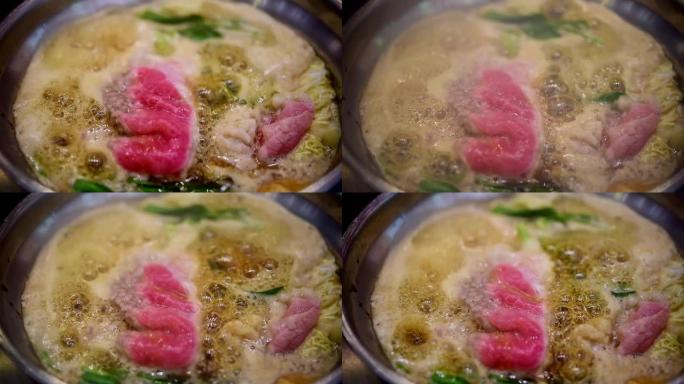 在火锅中烹饪食物以制作寿喜烧或sha锅