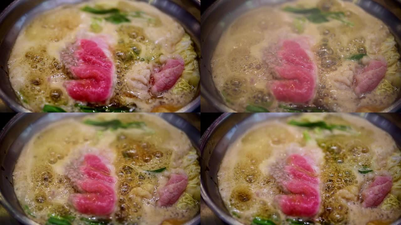 在火锅中烹饪食物以制作寿喜烧或sha锅
