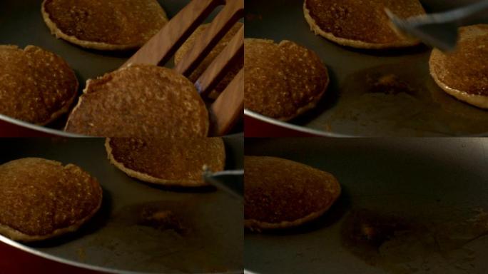 Macro Spatula将锅上油炸的燕麦煎饼翻过来