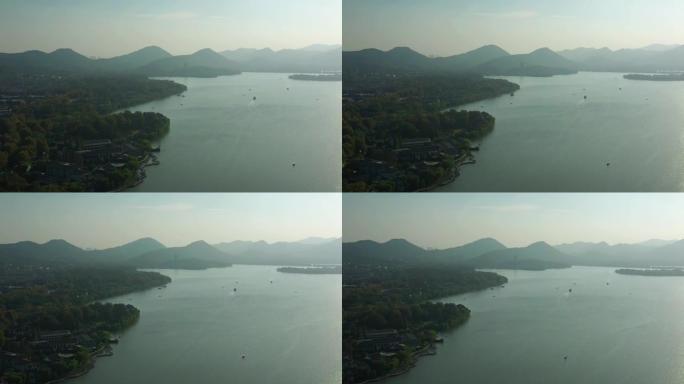 杭州市晴天飞行在著名的湖交通湾公园空中全景4k中国