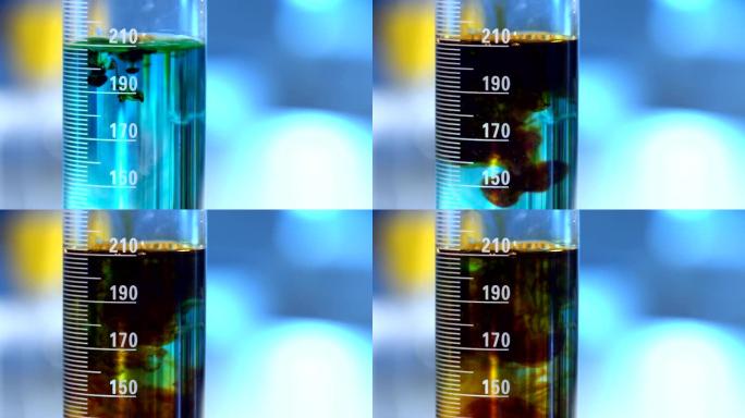 烧杯中的蓝色液体。蓝色液体中的棕色液体扩散