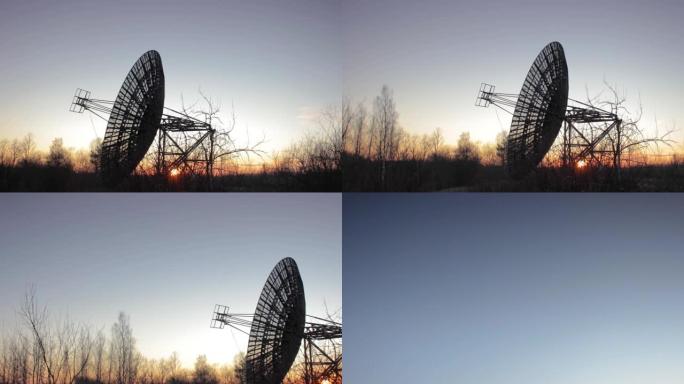 日落景观中的射电望远镜碟形卫星设备