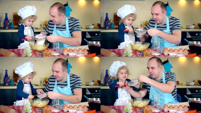慈爱的父亲和她兴奋可爱的女儿女孩在厨房里筛选面粉