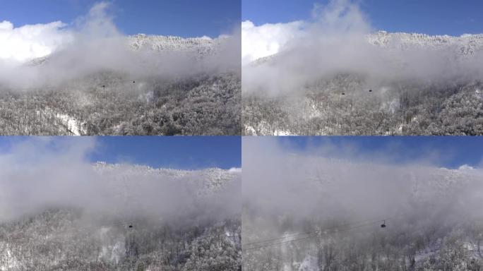 冬季度假胜地无人驾驶滑雪缆车穿越云层的惊人鸟瞰图。索道上的滑雪电梯运送滑雪场的人。蓝天景观上的无人机