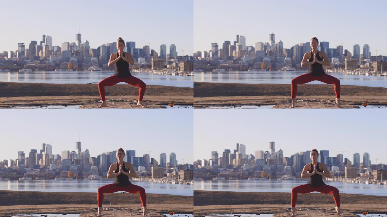 女性瑜伽强四边形平衡系列坐姿城市天际线背景
