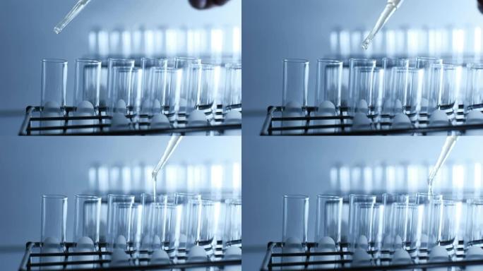 科学家在实验室实验中将化学溶液滴入试管中。化学和石油概念