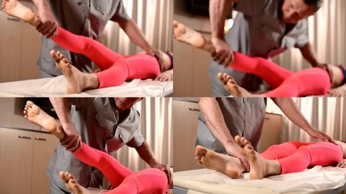 男性手动内脏治疗师按摩师治疗一名年轻女性患者。与下背部的臀部和骨盆肌肉一起工作