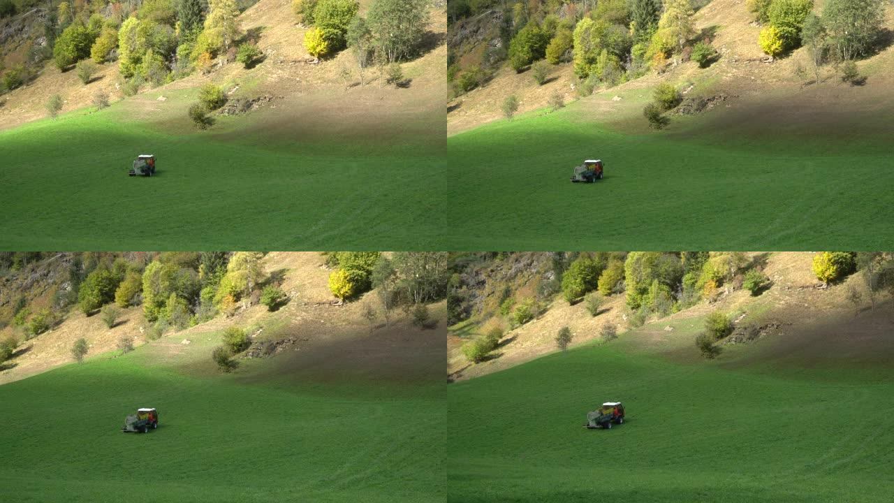 一辆粪肥车在上阿迪杰山脉的一片绿地上倒退