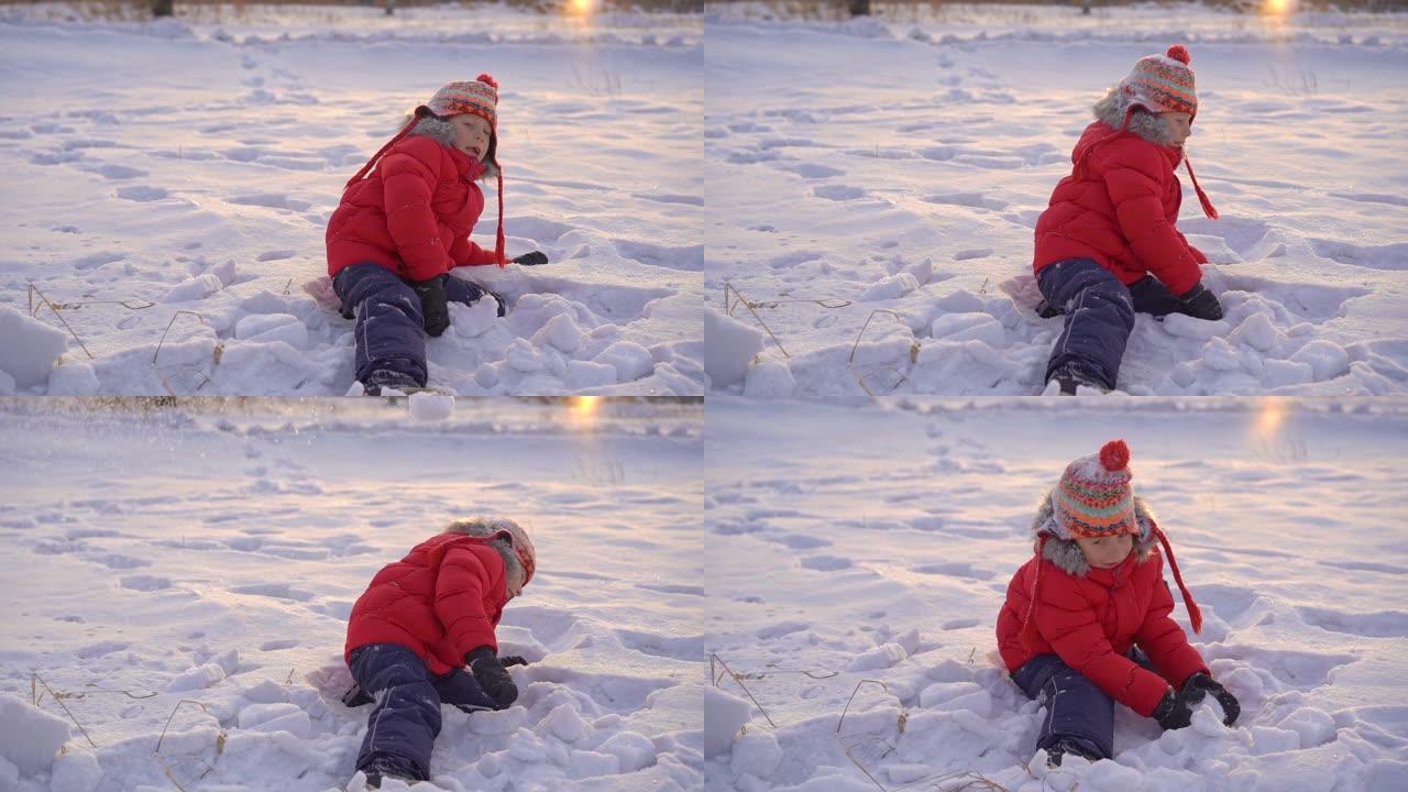 小男孩和他妈妈玩雪球。慢动作镜头