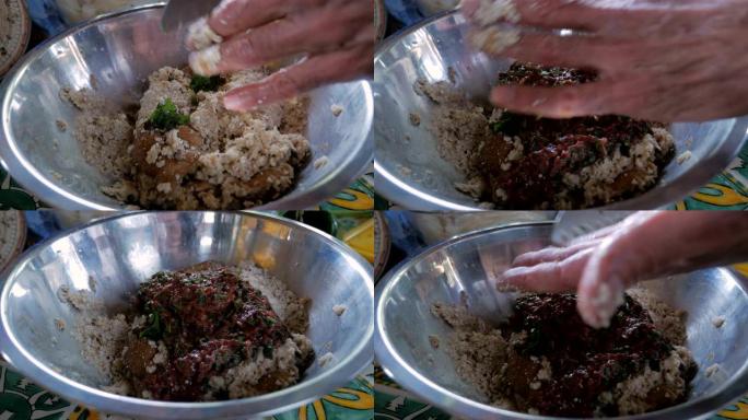 在将切碎的肝脏添加到碗中时准备的matzo球混合物的特写