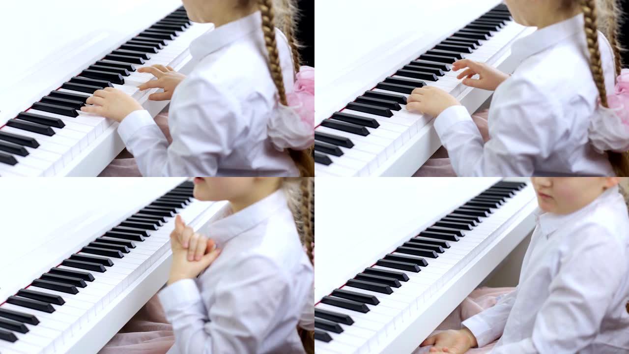 小女孩在白色钢琴上演奏古典音乐