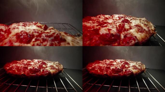 快速微距特写相机多莉跟踪拍摄美味热气腾腾的深盘意大利辣香肠比萨饼新鲜出炉在冷却架上的加热灯结束在框架