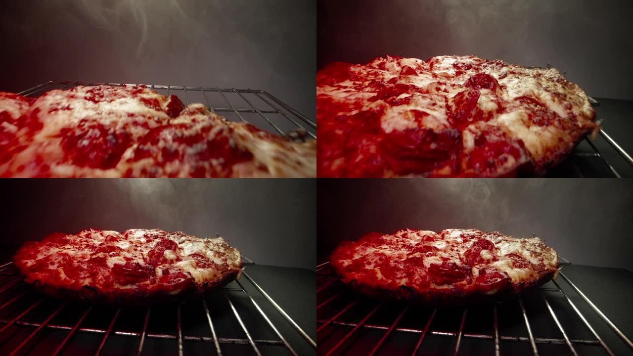 快速微距特写相机多莉跟踪拍摄美味热气腾腾的深盘意大利辣香肠比萨饼新鲜出炉在冷却架上的加热灯结束在框架
