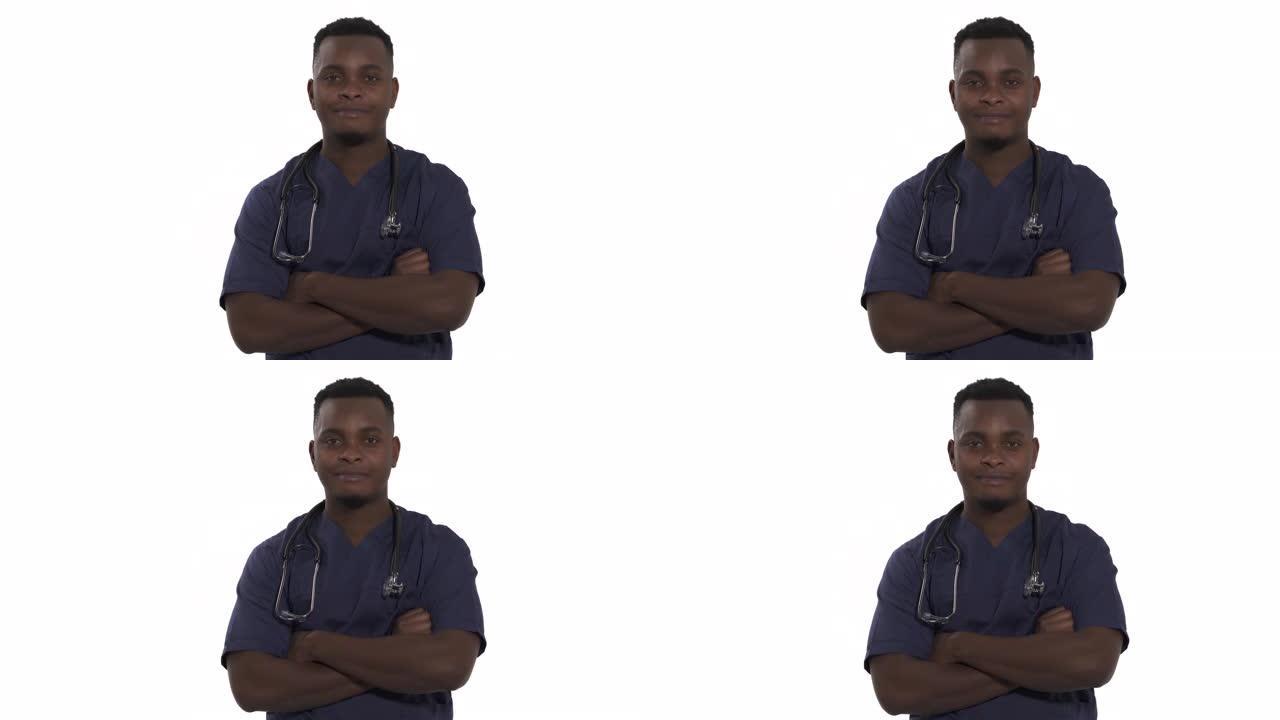年轻的非洲医生双臂交叉站着的特写镜头，微微点头。赞同手势，积极符号，肢体语言概念