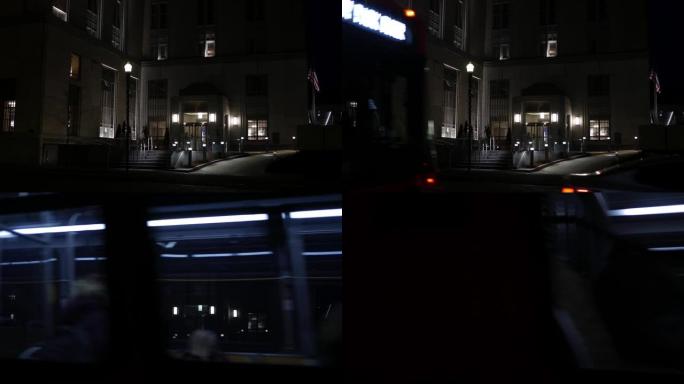 市区公司政府行政大楼的夜间建立镜头-前景中的交通交叉-版本3