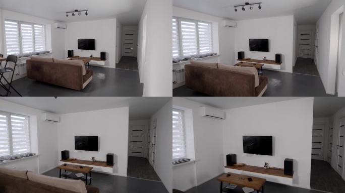 斯堪的纳维亚室内舒适公寓客厅中的家庭影院系统