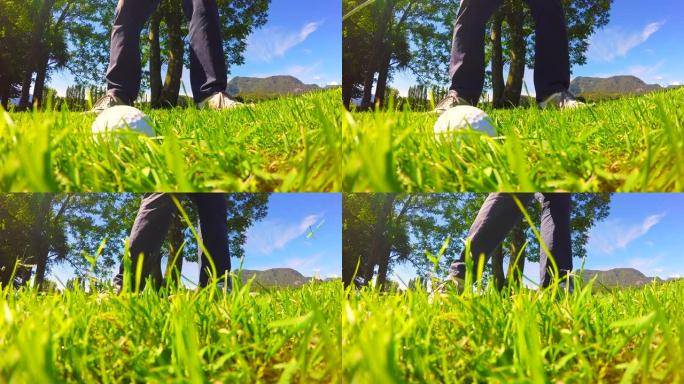 高尔夫球手在晴朗的日子里在粗糙的草地上击球