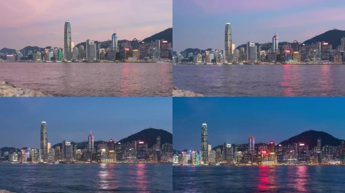 香港天际线的时间流逝，中国香港维多利亚港上空的香港城市景观市中心摩天大楼