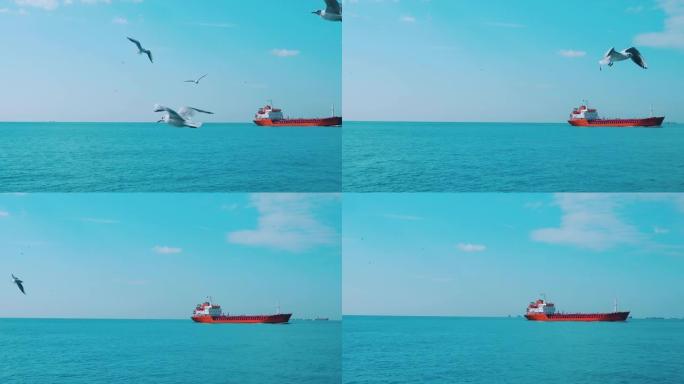 大型红色油轮在夏季右侧的蓝色海上航行