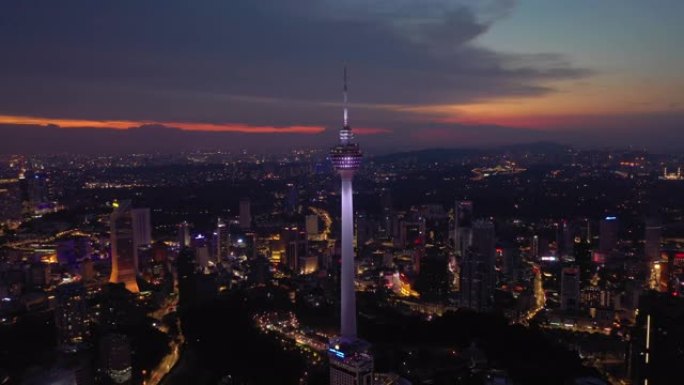 吉隆坡城市日落天空黄昏照明市中心电视塔空中全景4k马来西亚