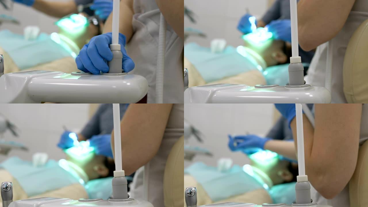牙医助理在支架上固定大的白色吸力