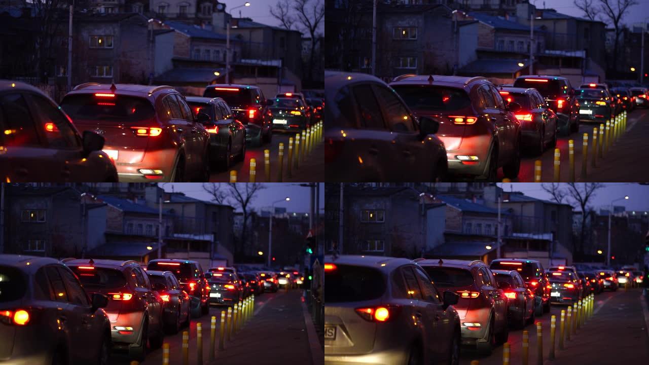 汽车交通的社论镜头，汽车在高峰时间停在红灯下在罗马尼亚布加勒斯特市中心，2020