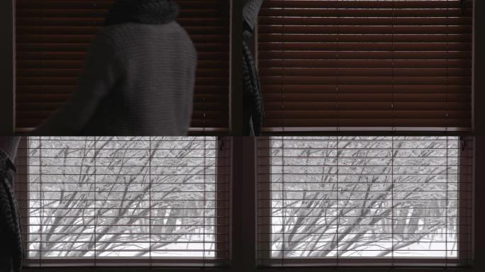 女人打开百叶窗，用雪露出冬天的外表