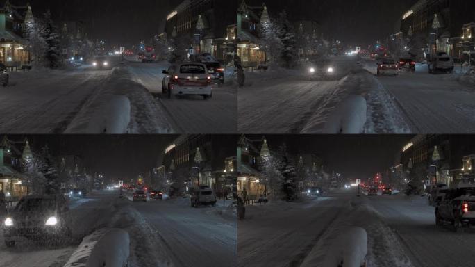 雪落在圣诞灯上冬天雪景冰路面下雪的夜景