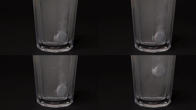 阿司匹林滴玻璃水，溶解水，药物，黑色背景，气泡