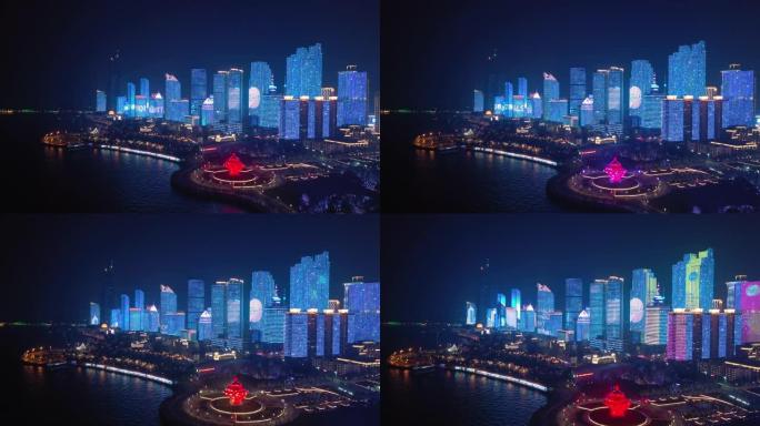 夜间照明显示青岛市市中心著名海湾广场航空全景4k中国