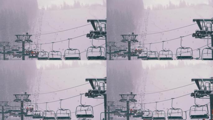 滑雪胜地的滑雪缆车。滑雪者在滑雪椅电梯上爬到下雪坡