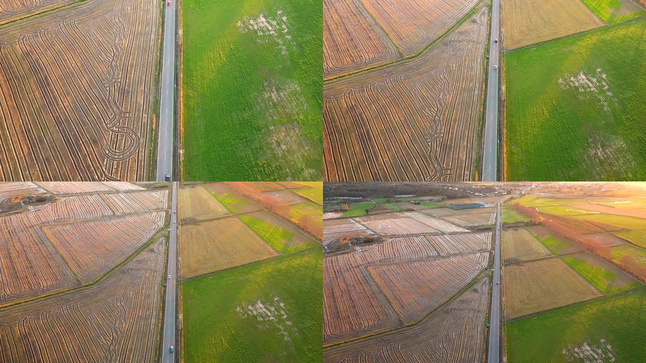 西班牙赫罗纳，农村公路穿越农田的鸟瞰图。