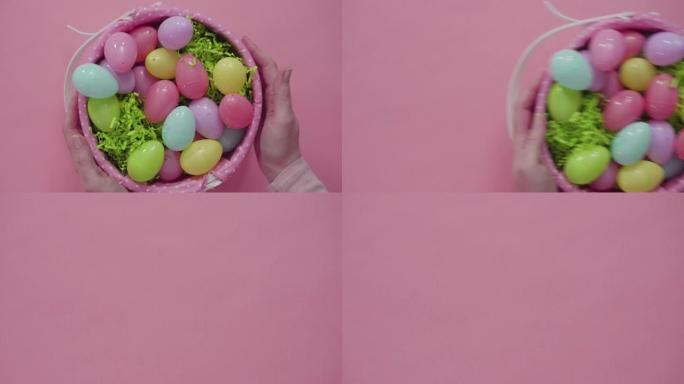 复活节篮子，粉色背景上有复活节彩蛋。