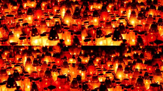 晚上墓地里有很多蜡烛。诸圣日。