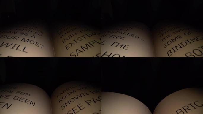 多莉拍摄的相机在书信之间滑动。带有黑色戏剧背景的打开书中的拉丁字母和单词。教育、知识理念