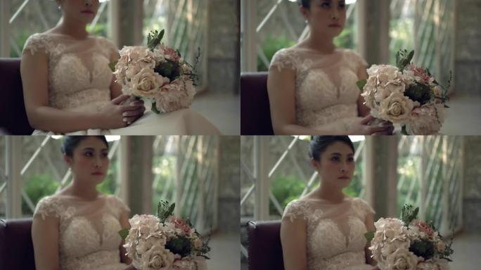 新娘手中的一束鲜花。工作室里的新娘。假花束的特写。手持镜头