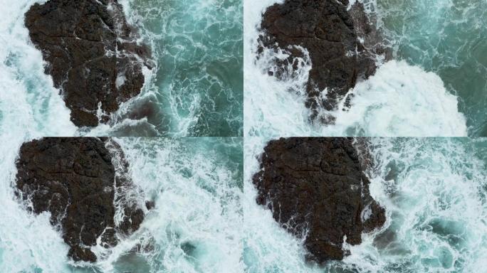 考艾岛Lumahai海滩上海浪撞击岩石的垂直俯视图