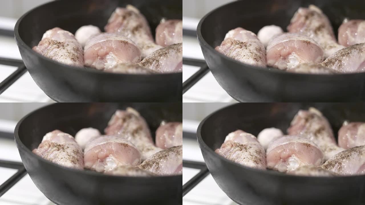 在铸铁煎锅中制作平底锅炸鸡腿。