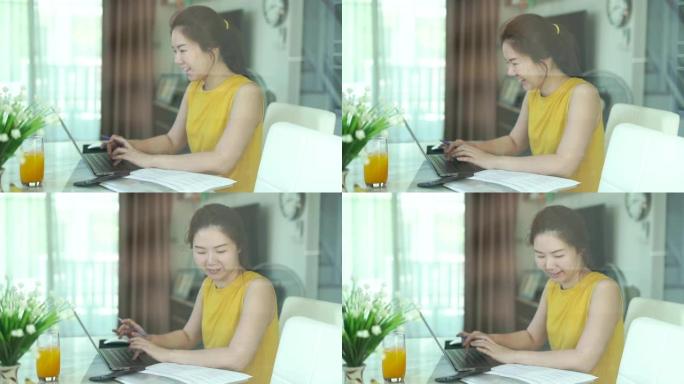 Cirebonid-19流行病病毒妇女在家工作。在笔记本电脑上工作的女性。