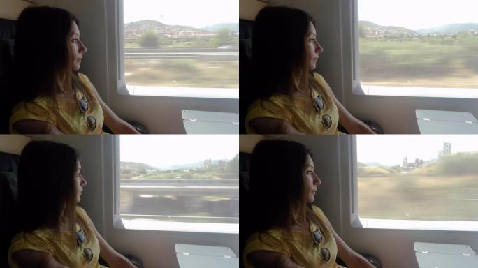 美丽的女孩若有所思地看着火车窗外。4K