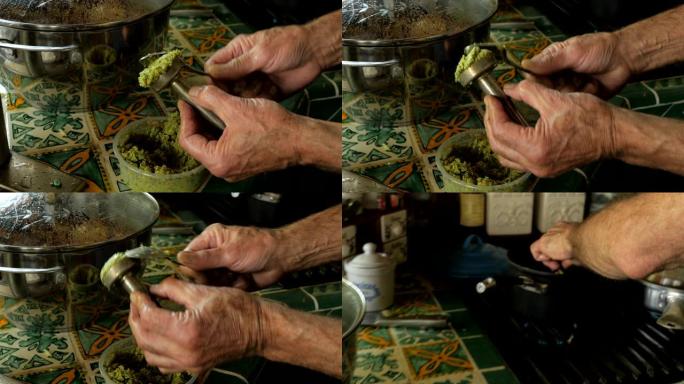 一个男人制作自制沙拉三明治并将其放入锅中的特写镜头