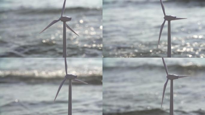 风力发电机在美丽的海洋景观中生产可再生绿色能源，替代可再生风能是对环境友好的产业。可持续发展技术概念