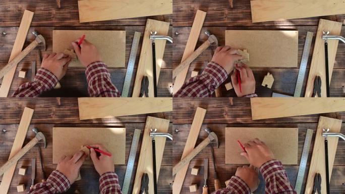 在木工店里工作的木匠。家具和家居装饰制作概念的木制品。装饰用DIY木材