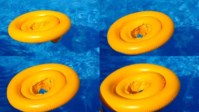 游泳池蓝色水面上的漂浮环，波浪在夏日的阳光下反射