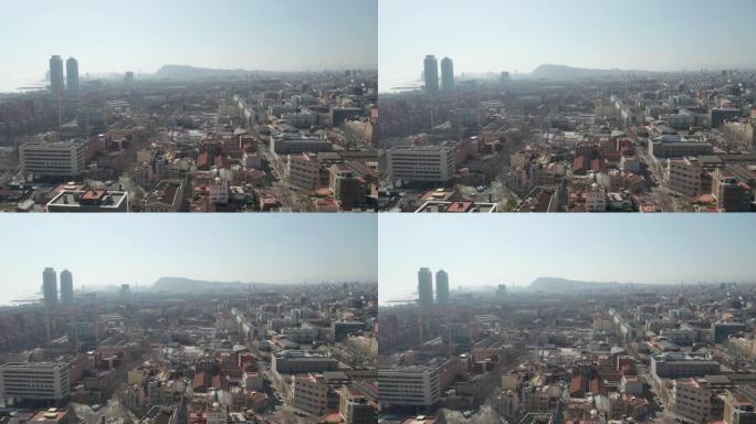 空中: 巴塞罗那朦胧城市景观的宽无人机 [4K]