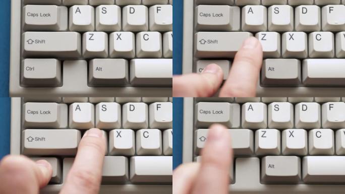 男性手指按下白色键盘上的CTRL Z按钮。慢动作和宏观视图