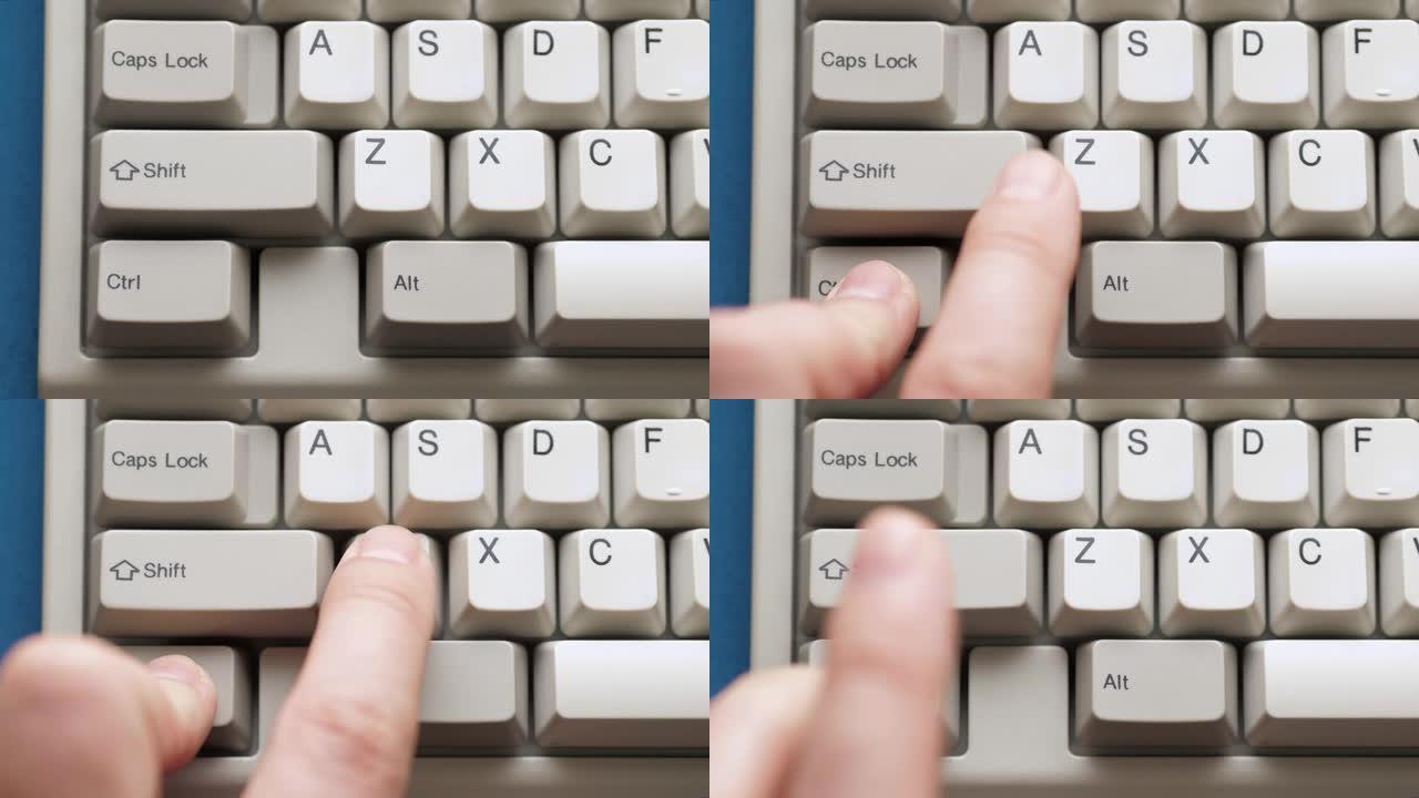 男性手指按下白色键盘上的CTRL Z按钮。慢动作和宏观视图